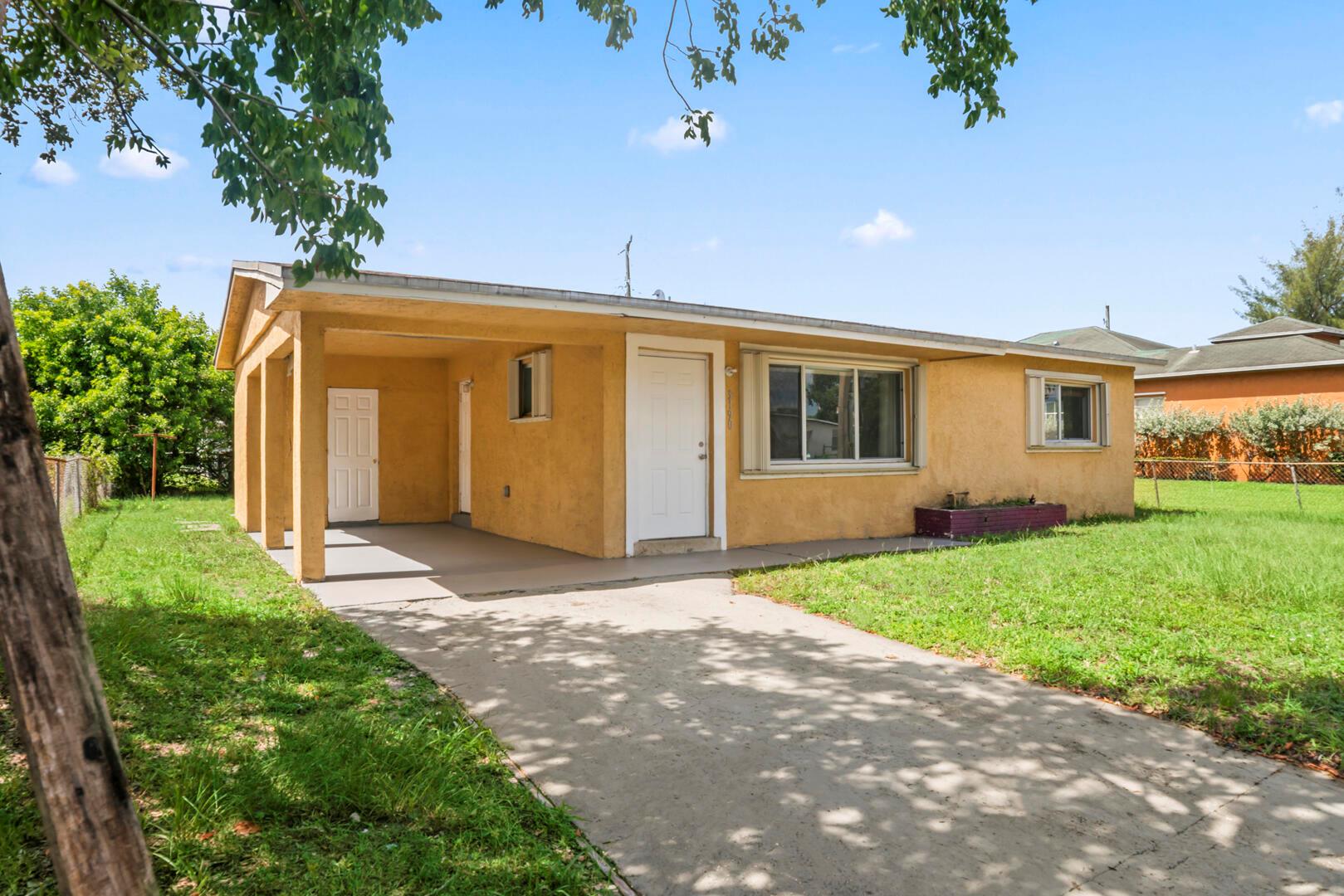 Welcome to 3190 NW 5th Ct, Lauderhill - a versatile 4BR/2BA, 1,610 sq ft home with a unique split floorplan. Built in 1996, this property features two living rooms, dual master suites, and a remodeled kitchen with wet bar. Recent updates include a 2016 roof, 2022 AC, PVC plumbing, newer windows with accordion shutters, plus a covered carport, large yard, and full laundry room. The split layout allows one half to be rented out, making it ideal as a primary residence, investment, or house-hack opportunity. Conveniently located near shopping, schools, I-95, the airport, and beaches. A rare find offering comfort, flexibility, and income potential all in one.