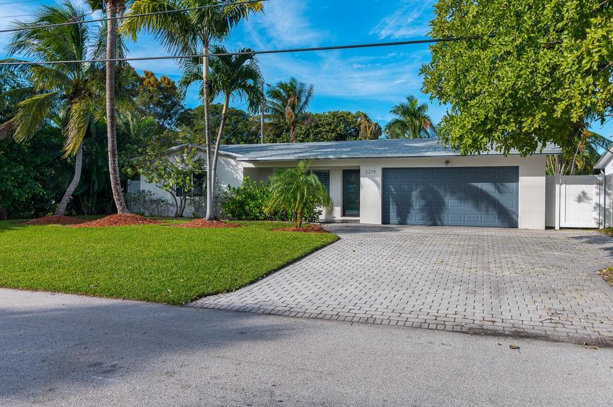 Fully renovated in 2021, this home has been updated for both comfort and style, giving 2,127 sqft of bright, open living space. A new roof, HVAC, and pool mechanicals installed in 2021 as well as hurricane impact glass sliders that flood interior with light and offer seamless access to your completely private outdoor retreat. Offers a 60ft dock and a 24,000lb boat lift, installed in 2023, for the ultimate boating experience with no fixed bridges offering direct ocean access. The new in-ground pool is surrounded by a newly installed marble patio and fenced yard designed with privacy and entertaining in mind. It features a 3/2 split-bed layout w/elegant touches-walk-in closet w/ custom cabinetry, custom kitchen cabinets and appliances, 2car garage, and laundry room with updated appliances.