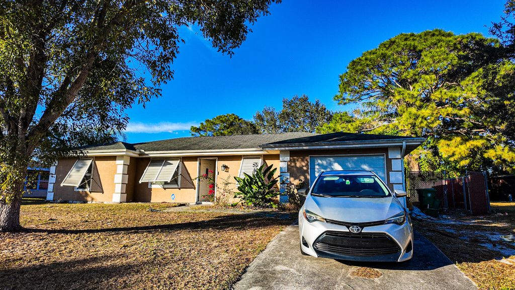 Photo of 410 SW Kentwood Road, Port Saint Lucie, FL 34953 (MLS # R11163171)