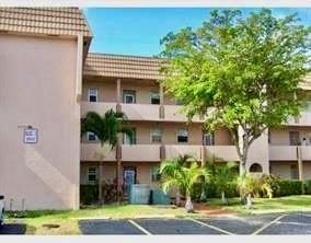 The Price is Right! This 1st floor lakefront unit is in the perfect location. The views are breath-taking! Near the clubhouse with lots of available parking. Walking distance to Olympic sized swimming pool in community with lake views across from pool. Restaurants, shops and the bus stop are all within walking distance. This 1 bed 1 bath unit has a great layout with a Florida Room. Come and see, you can make this unit uniquely yours!