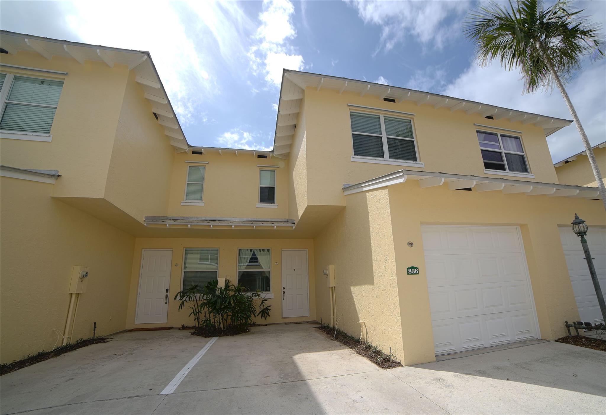 Centrally and conveniently located near shops, dining, beach and entertainment. This is lovely and spacious two-story townhouse with soaring high volume ceilings with lots of natural light and cherry wood floor throughout the ground level, which consists of a formal living and dining, kitchen, a half-bathroom and one car garage; White wood cabinets, and granite counter-tops in the kitchen. Laminate-wood floors upstairs which consists of two bedrooms and two bathrooms. There is a charming patio, perfect for BBQ and entertaining. Walk to the community pool. The location is ideal, just 1 mile from the beach and walking distance to Deerfield Elementary