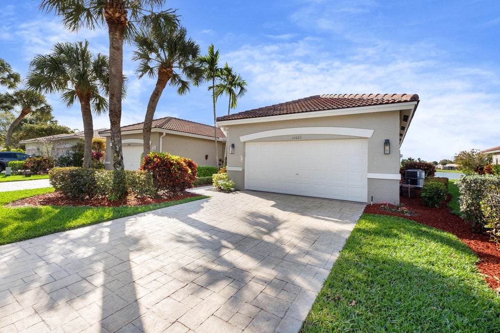 Photo of 10665 ROYAL CARIBBEAN Circle, Boynton Beach, FL 33437 (MLS # B26077237)