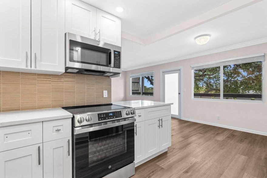 Beautiful updates in this pristine two bedroom and full two bath unit. Located in the BEST luxury building of Century Village East. New Roof. No assessments. All inspections completed. Reserves met. New impact windows and doors throughout. Open kitchen concept with white shaker cabinets, brand-new, stainless-steel GE appliances, quartz countertops, and glass tile backsplash. Top of the line wood-look laminate flooring. Freshly painted with elegant and neutral high-end paint. No Popcorn on ceilings. Primary room has large walk-in closet with custom built-ins and fully updated ensuite bathroom with glass shower doors. Guest bathroom is also fully updated. Spacious second bedroom with both rooms leading out to your private enclosed Patio overlooking the protected nature preserve. South facing patio has ample Florida sunshine and beautiful views of the serene nature preserve. Complete with newer A/C & brand new water heater. Oakridge D is extremely well-maintained building. Century Village has a newly redesigned clubhouse that offers over three-acres of entertainment, fitness, arts, resort style pool and indoor pool. Located just 3.5 miles from the Beach. Close to 95, turnpike, sawgrass, shopping and restaurants.