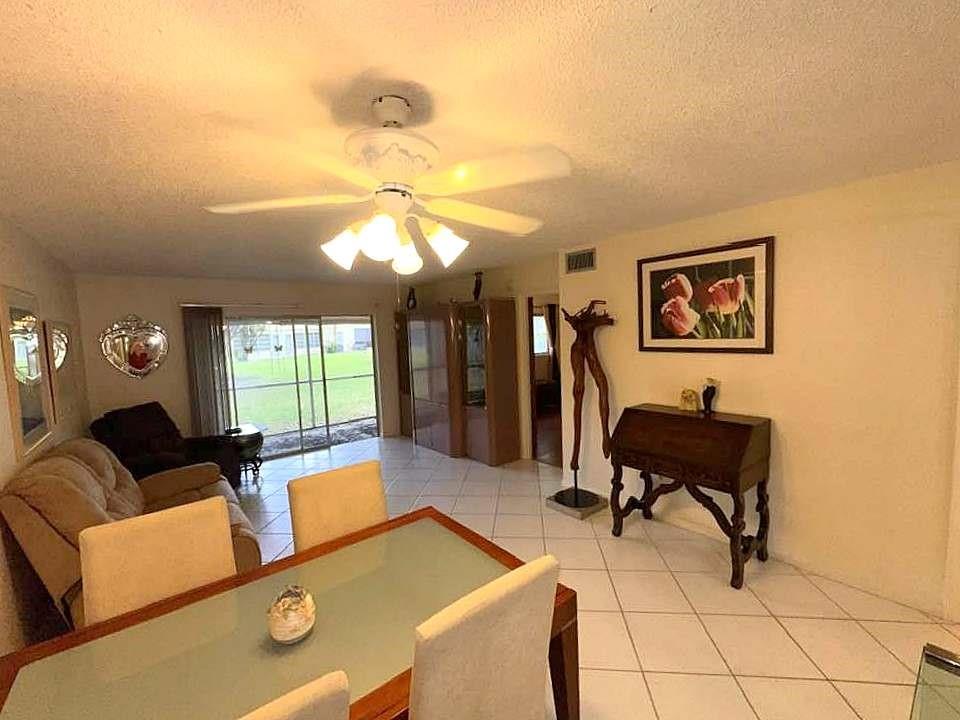 BEST PRICED - Beautiful Ground Floor Unit in Sought After Oriole Gardens Three ** Enjoy the Good Life ** Active Community Full of Amenities and Social Clubs ** Immaculately Maintained - Sold by Original Owner ** Move In Ready ** Tile Flooring in Living Areas - Laminate Flooring in Bedrooms ** Bathrooms Updated ** New A/C ** Kitchen is Light and Bright ** Luxurious $15k Custom Walk-In Spa Bathtub in Primary Bedroom ** Custom Cabinetry ** Beautiful Green Space and Mature Trees in Back Yard ** Walking distance to where all the Fun is - The Club House and Pool ** Abundance of Parking directly in Front ** Laundry and Storage Room Steps Away ** Our Favorite Mall - Coral Square Mall is Down The Street ** Brand New Publix walking Distance **