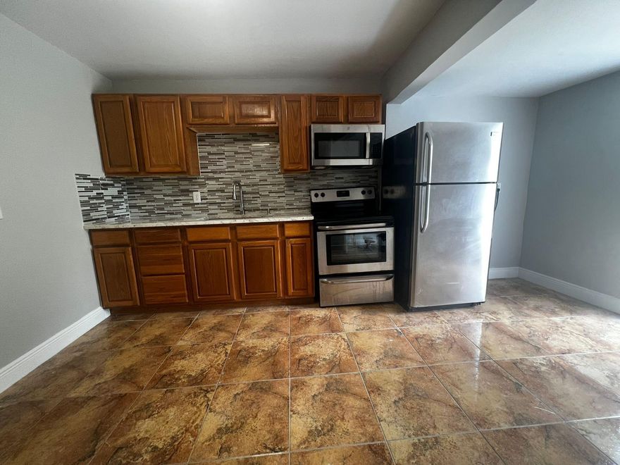 Beautiful Totally renovated 3/2, Newer Kitchen with New Granite Counters and Stainless steel Appliances, New Bathrooms, Freshly Painted, 1 Car Port, Huge Back Yard in Oversized Lot Bring your RV, Trailer =or Boat! Hurry Wont Last!