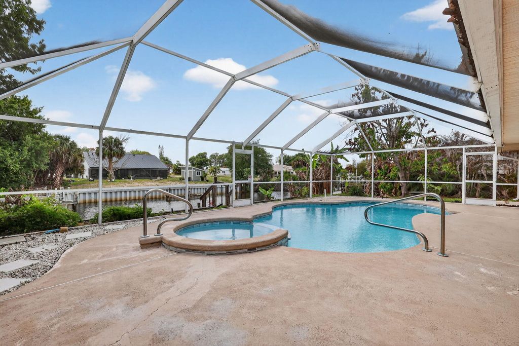 Photo of 320 NE Surfside Avenue, Port Saint Lucie, FL 34983 (MLS # R11158141)