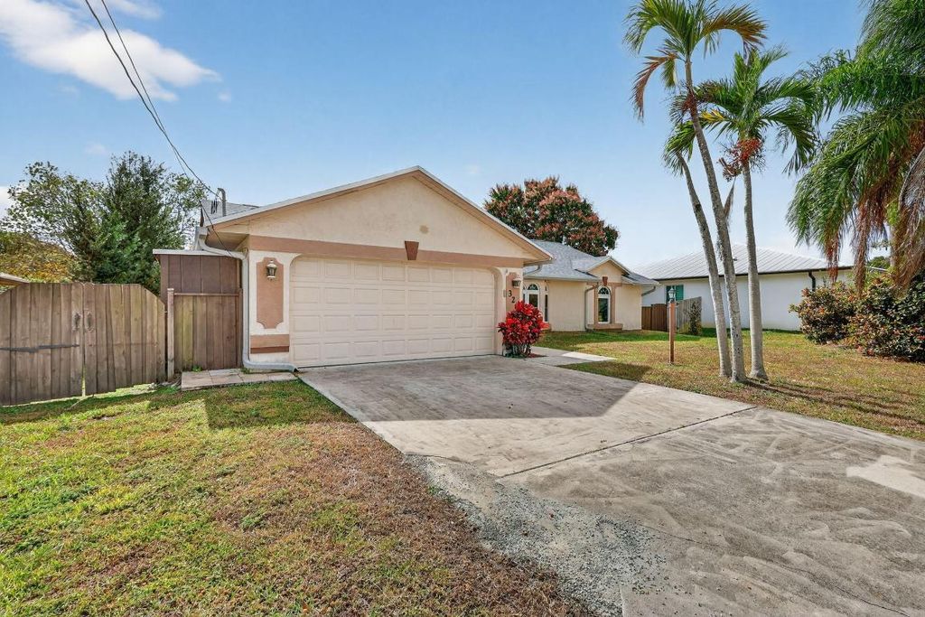 Photo of 320 NE Surfside Avenue, Port Saint Lucie, FL 34983 (MLS # R11158141)