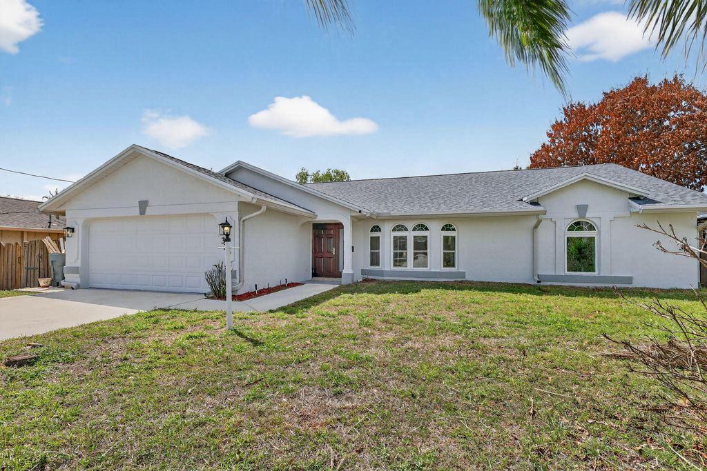 Photo of 320 NE Surfside Avenue, Port Saint Lucie, FL 34983 (MLS # R11158141)