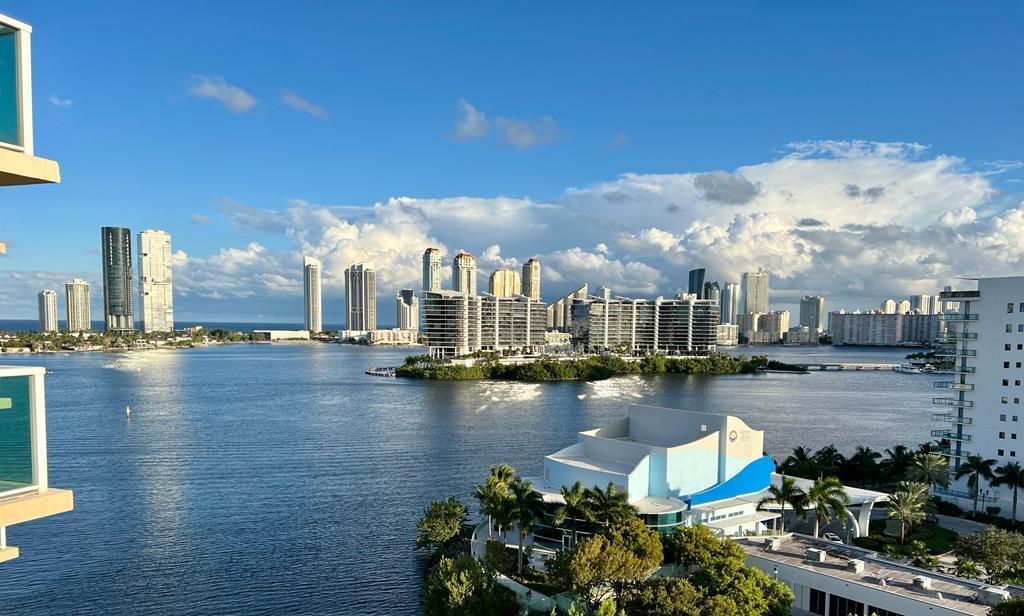 Beautiful 2 bedroom 2.5 bath (plus den/possible 3br) condo with direct ocean/bay/city views on the most desirable line in the most desirable building. Contemporary kitchen, stainless appliances, new porcelain flooring throughout, new washer/dryer, Walk-in closet in the master, dual sinks in master bath, roman tub, impact windows, Incredible views. Aventura Marina 2 boasts a 24 hour valet, 2 pools, jacuzzi, gym, clubhouse, marina, spa and much more. Walk to shopping, dining and entertainment. This is the reason you live in South Florida.
