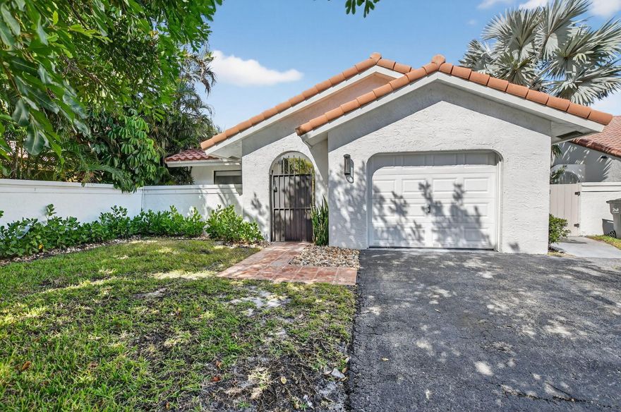 Welcome to Rainberry Lakes! This beautifully maintained 2-bedroom, 2-bath home sits on an oversized lot in this sought-after all-age, gated community. Enjoy resort-style outdoor living with a stunning salt water pool and spa, marble pavers, and a spacious covered patio area, perfect for entertaining or relaxing in privacy. The large grassy yard is ideal for pets and outdoor fun.Inside, you'll find a bright, open split floor plan with an updated kitchen, oversized living area, and a spacious laundry room. A built-in office nook near the entry provides the perfect workspace, offering great functionality in place of a third bedroom. While the garage does not fit a full-sized car, it's perfect for a golf cart, bikes, or extra storage.