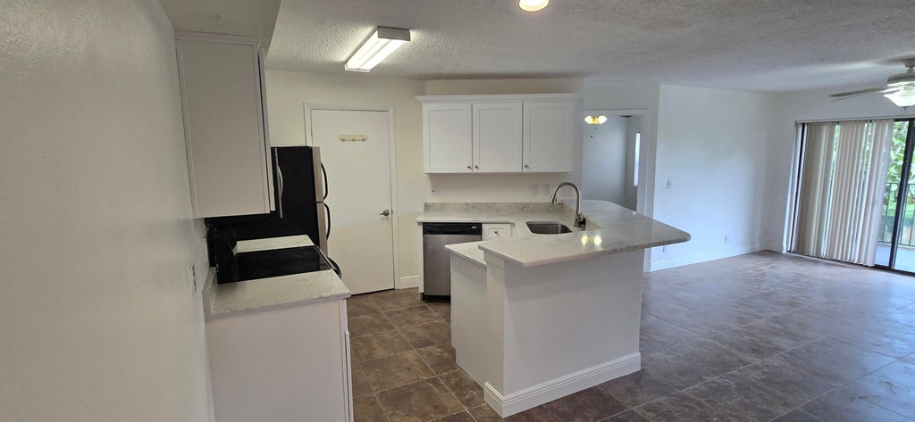 Photo of 9999 SUMMERBREEZE Drive #417, Sunrise, FL 33322 (MLS # B26060176)