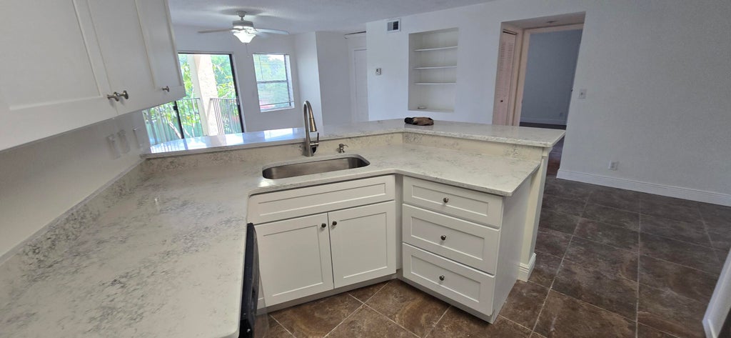 Photo of 9999 SUMMERBREEZE Drive #417, Sunrise, FL 33322 (MLS # B26060176)