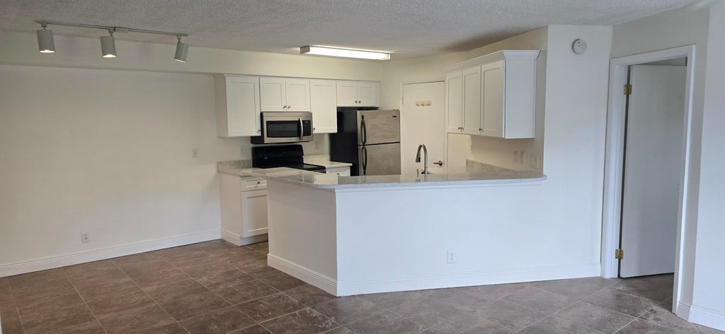 Photo of 9999 SUMMERBREEZE Drive #417, Sunrise, FL 33322 (MLS # B26060176)