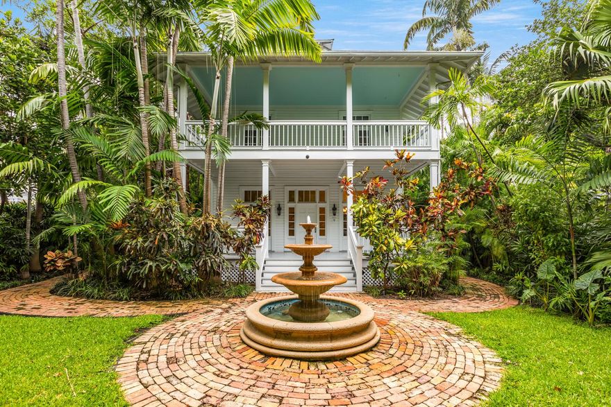 This exquisite private estate in the Truman Annex is one of the few properties with a Whitehead st. address. This estate is one of the historical  gems of Key West. At one time it was the Coast Guard Commanders quarters.This 14,410 sf. lot is one of the largest in the Truman Annex. The main house  is two stories with a working fireplace  in the great room. It boasts a high end  designer kitchen,  Wolf and SubZero appliances. There are three bedrooms , two full baths and a half in the main house. The Master  has a walk-in closet, Laundry and private balcony. Plenty of outdoor porch areas around the main house connect it to the guest quarters, two bedrooms with a full bath. The grounds are lush and tropical with an outdoor bar finished with stainless appliances.  The patio area will not not disappoint with a cabana bath, outdoor shower and laundry. The heated pool has an artfully done waterfall. There is a very private spa nestled into the tropical setting.The carport has room  for 3-4 cars. Plenty of storage sheds throughout the grounds.Full security system, electronic gated of course the piece  of mind with the manned security in the Annex.The home is equipped with a generator. This historic well maintained property will satisfy the most discerning buyer. Just the right mix of history with all the modern touches.