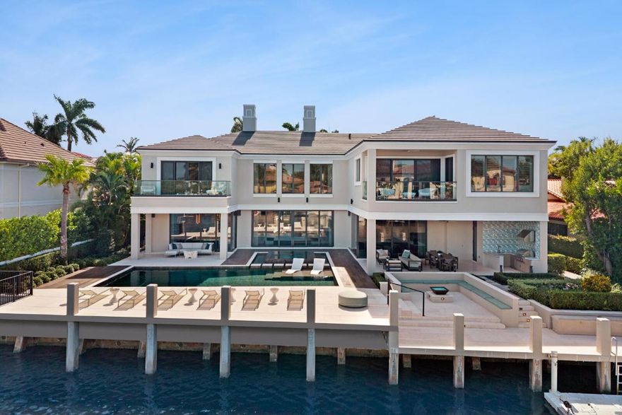 Stunning waterfront estate located in Boca Raton's ultra-exclusive, guard-gated Sanctuary neighborhood one of the safest and most prestigious deep-water communities in the nation. This newly updated residence showcases over $1,000,000 in recent upgrades, delivering a refined blend of architectural elegance, modern luxury, and seamless indoor-outdoor living. Step into a grand foyer with soaring 30'+ awe-inspiring ceilings, dramatic window walls, and expansive open living spaces filled with natural light. The home features a designer
entertainment bar, billiards, gym room, chef's kitchen with top-tier appliances, media room, private elevator, and multiple living and dining spaces ideal for both family life and sophisticated entertaining.   See supplement. Recognized by Forbes as one of the Top Ten Exclusive and Expensive Gated Communities in the United States, this is a rare chance to own a fully upgraded estate in one of Boca Raton's most coveted and secure waterfront enclaves.  

Stunning waterfront estate located in Boca Raton's ultra-exclusive, guard-gated Sanctuary neighborhood - one of the safest and most prestigious deep-water communities in the nation. This newly updated residence showcases over $1,000,000 in recent upgrades, delivering a refined blend of architectural elegance, modern luxury, and seamless indoor-outdoor living.

Step into a grand foyer with soaring 30'+ awe-inspiring ceilings, dramatic window walls, and expansive open living spaces filled with natural light. The home features a designer entertainment bar, billiards room, gym room, chef's kitchen with top-tier appliances, media room, private elevator, and multiple living and dining spaces ideal for both family life and sophisticated entertaining.

The luxury primary suite is a resort retreat of its own - featuring dual bathrooms, separate his & hers closets, private sitting areas, and serene water views. Guest suites are spacious and private, each offering its own upscale finishes. 

Enjoy the South Florida lifestyle from a resort-style pool, lush landscaping, and a private dock with deep-water access, perfect for yachting. Additional enhancements include updated flooring, custom lighting, refined millwork, elevated finishes throughout, and meticulous maintenance in every area of the home.

Located in The Sanctuary - an elite yachting community with 24/7 armed gate security, water patrol, and a private marina - this residence provides unmatched peace of mind and exclusivity. Just minutes from Boca Raton's private airport, I-95, Boca Country Club, Mizner Park, world-class dining, pristine beaches, and premier shopping.

The Sanctuary HOA covers:
~ Security: 24/7 armed guard gated entry, roving patrols, monitored access for both land and waterfront.
~ Exclusive Amenities: Private 20-slip marina, tennis/basketball court, playground, and a 27-acre bird/wildlife preserve.
~ Common Area Maintenance: Care of all community landscaping, roads, and shared common spaces.
~ Concierge Services: Additional personal assistance for residents is provided as part of HOA membership
~ Privacy: High standards for resident safety and seclusion, contributing to the community's reputation as one of the most secure and     exclusive in the area.