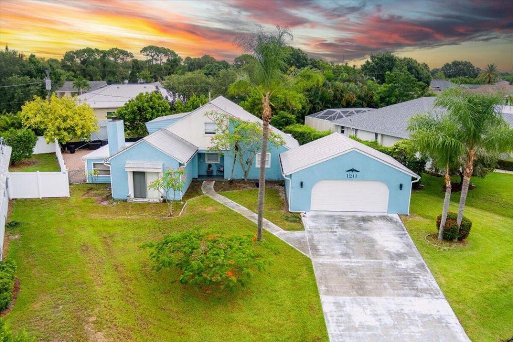 Photo of 1211 SE Mendavia Avenue, Port Saint Lucie, FL 34952 (MLS # R10996301)