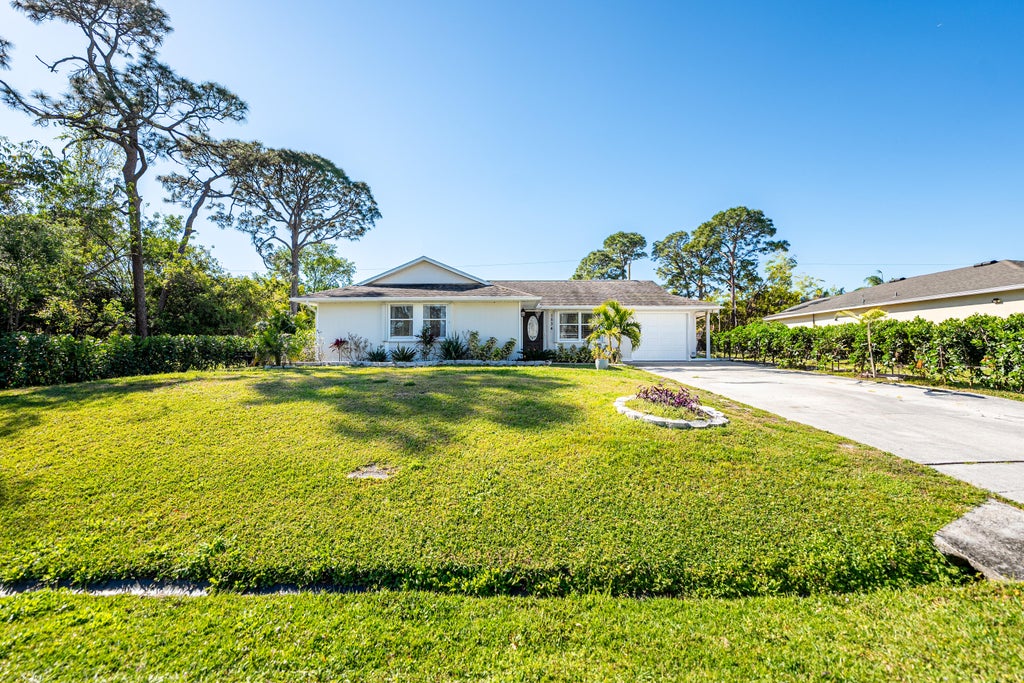 Photo of 1534 SW Kamchatka Avenue, Port Saint Lucie, FL 34953 (MLS # R11071039)