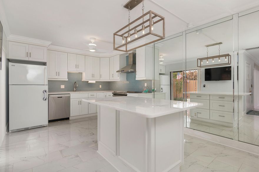 Welcome Home! Meticulously renovated 2-bedroom, 2.5 bathroom townhome ready to welcome you home! Beautiful chefs kitchen equipped with white shaker cabinetry, quartz countertops, large island with seating and top of the line stainless steel appliances! New Ceramic Tile, updated half bath, updated master shower and recently painted through out! Accordion shutters for hurricane protection, roof 2024. Seller Will Pay Roof Assessment. Two assigned parking spaces and plenty of guest parking! Large private lanai perfect for relaxing and soaking up the Florida lifestyle! Within walking distance to US1 and the intracoastal waterway! Conveniently located to restaurants and shopping! Directly across from the beautiful Tequesta Park! Wont last long!!