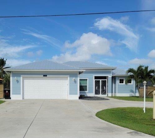 SELLER MOTIVATED BRING ALL OFFERSThis exquisite waterfront property offers unparalleled views and an unbeatable location in one of Port St Lucie's most desirable communities, with unobstructed views of the navigable waters, dock, and boat lift right in your backyard, this home's open home shows ownership pride! Newley completed 2019 on the water with ocean access, 4 bedroom, 3 bath home plus unique bonus flex space offers adaptable rooms, The kitchen boasts a center island, porch opens to backyard and private dock and Tiki, Listed below are some of the upgrades and items staying 8 Smart TV's will be staying, 8 channel Luma Camera System (will provide training on system),Smart Outlets and Switches (one Alexa enabled switch),Summer Kitchen, including Large green Egg