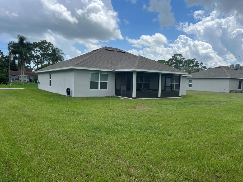Photo of 1517 SW Bermel Avenue, Port Saint Lucie, FL 34953 (MLS # R11013762)