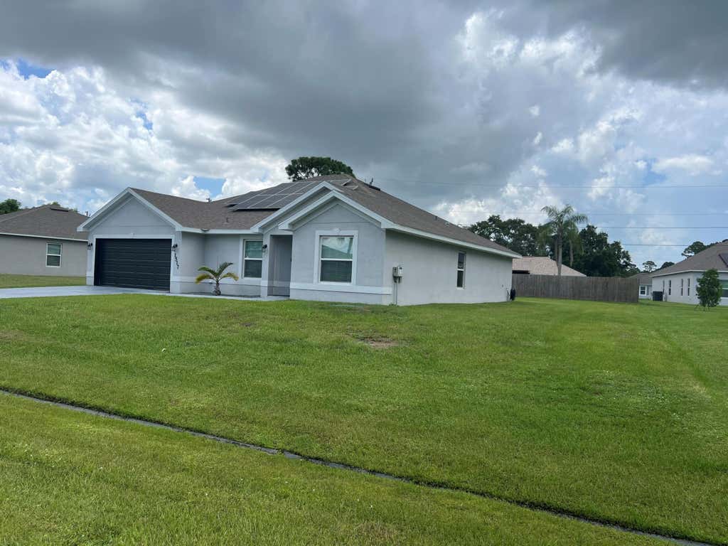 Photo of 1517 SW Bermel Avenue, Port Saint Lucie, FL 34953 (MLS # R11013762)