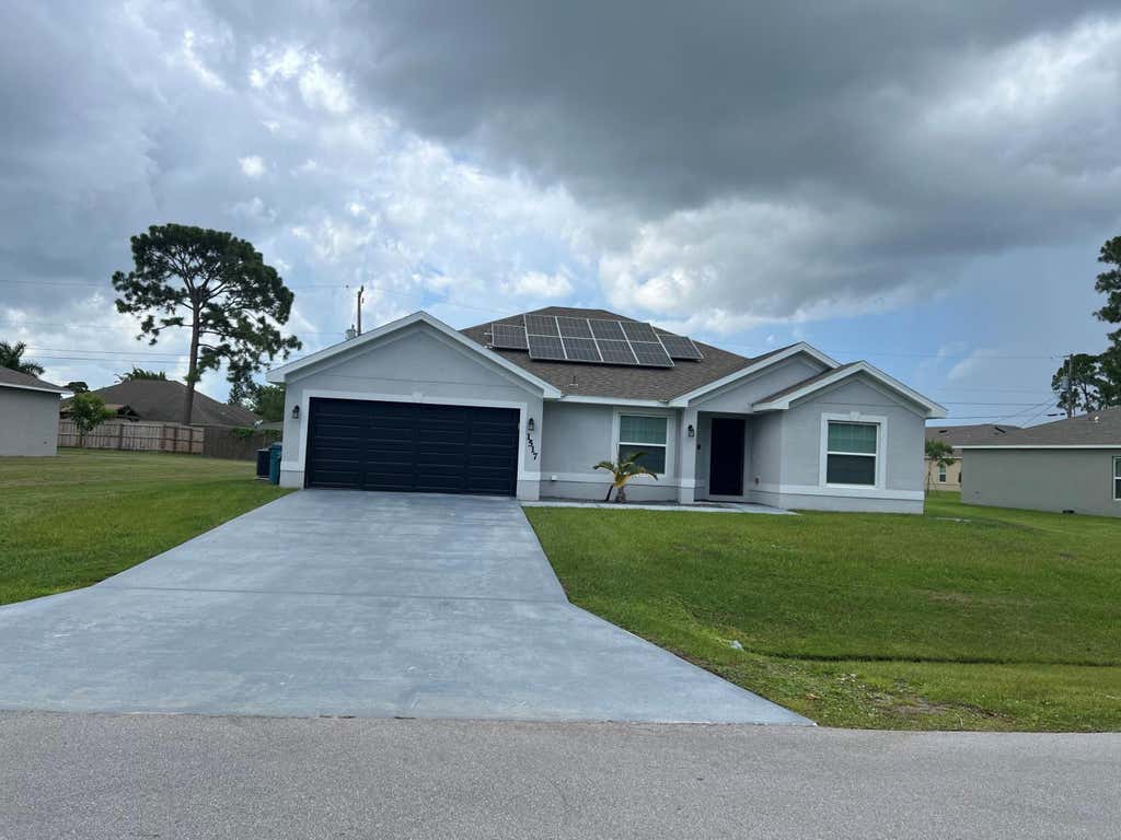 Photo of 1517 SW Bermel Avenue, Port Saint Lucie, FL 34953 (MLS # R11013762)