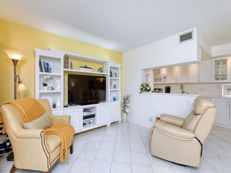 55+Step into the lap of luxury with this stunning (NOT LIKE THE OTHER ONE BEDROOMS) property in the highly sought-after Bimini Village. Every inch of this magnificent apartment is designed to leave you in awe. The kitchen is equipped with top-of-the-line appliances including WASHER/DRYER. Remodeled, has an open Kitchen concept, and is furnished with a sofa bed, what you'd expect to see in Architectural Digest. Inside is a washer-dryer in half bathroom, a shower in the master bathroom, all tiled flooring, and a newer jalousie glass enclosure. Entertain in the living room, dining kitchen, and patio, all in one great space. Seller-paid assessments for new roof 2024, elevator cab, and new swimming pool steps away. SEE ALL THE PHOTOS THEN SEE FOR YOURSELF. THIS IS ONE OF A KIND Disclaimer:  The information contained in this listing is not verified for authenticity or accuracy and is not guaranteed. This information is provided exclusively for consumers’ personal, non-commercial use and may not be used for any purpose other than to identify prospective properties consumers may be interested in purchasing.  Any photographs contained in this listing are for the sole purpose of showing a basic description and layout of the property and should not be relied on in lieu of an independent inspection of the property.  The consumer is required to independently verify appliances, light fixtures, and/or any other personal property that may or may not be included in the purchase of the property.