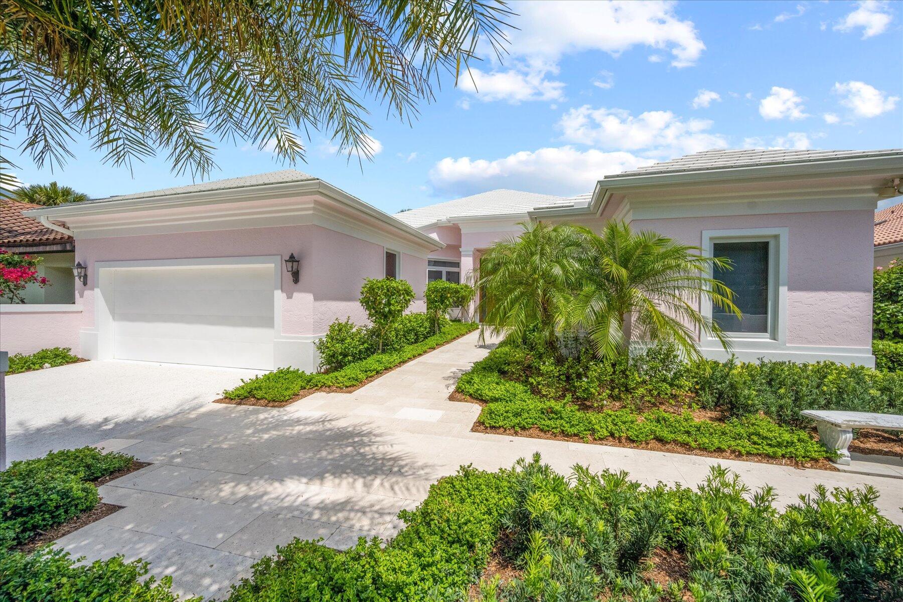 Exceptional Loxahatchee Club lake and golf course views can be found from this superbly remodeled single story 3 bedroom, 3 bath gem, with total privacy front and back. Custom remodel in 2020-2022 by a world renowned designer (see Bio below), no detail has been overlooked. Enter this gracious home with its classic Palm Beach tabby finished driveway through the elegant double doors to a grande foyer. Panoramic views across the water to the signature fourth and sixth golf holes, with open views from the living room, family room, and master suite. Great flow through kitchen, family room and large living room. Kitchen island opens to informal dining area, with formal dining room adjacent to kitchen. Split bedroom plan boasts an extraordinary private master retreat