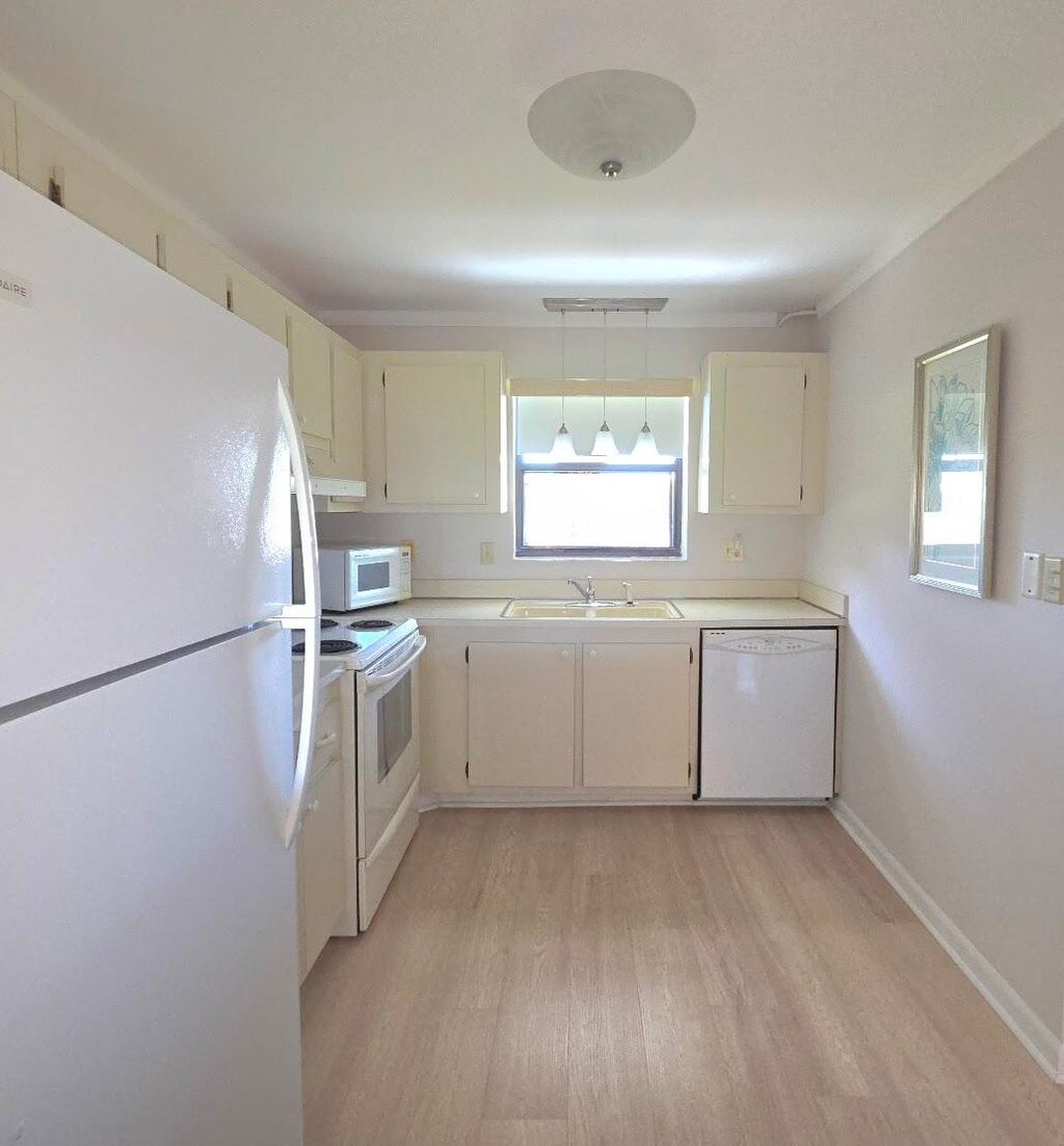 Photo of 2101 W Woolbright Road #J102, Boynton Beach, FL 33426 (MLS # B26020566)