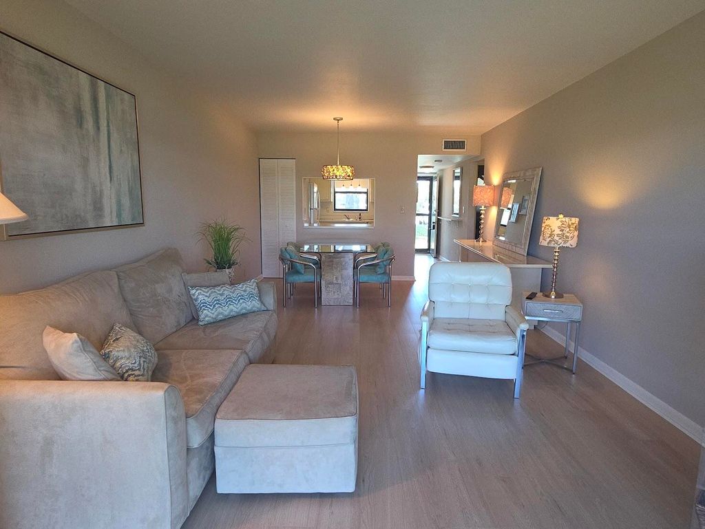 Photo of 2101 W Woolbright Road #J102, Boynton Beach, FL 33426 (MLS # B26020566)