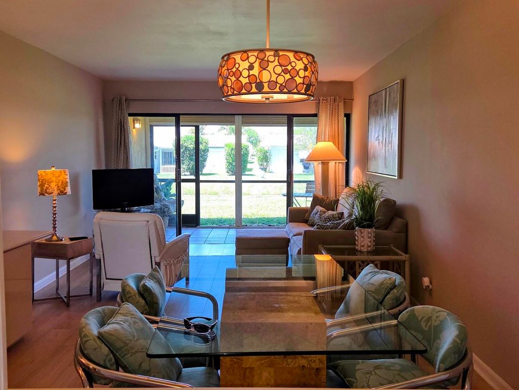 Photo of 2101 W Woolbright Road #J102, Boynton Beach, FL 33426 (MLS # B26020566)