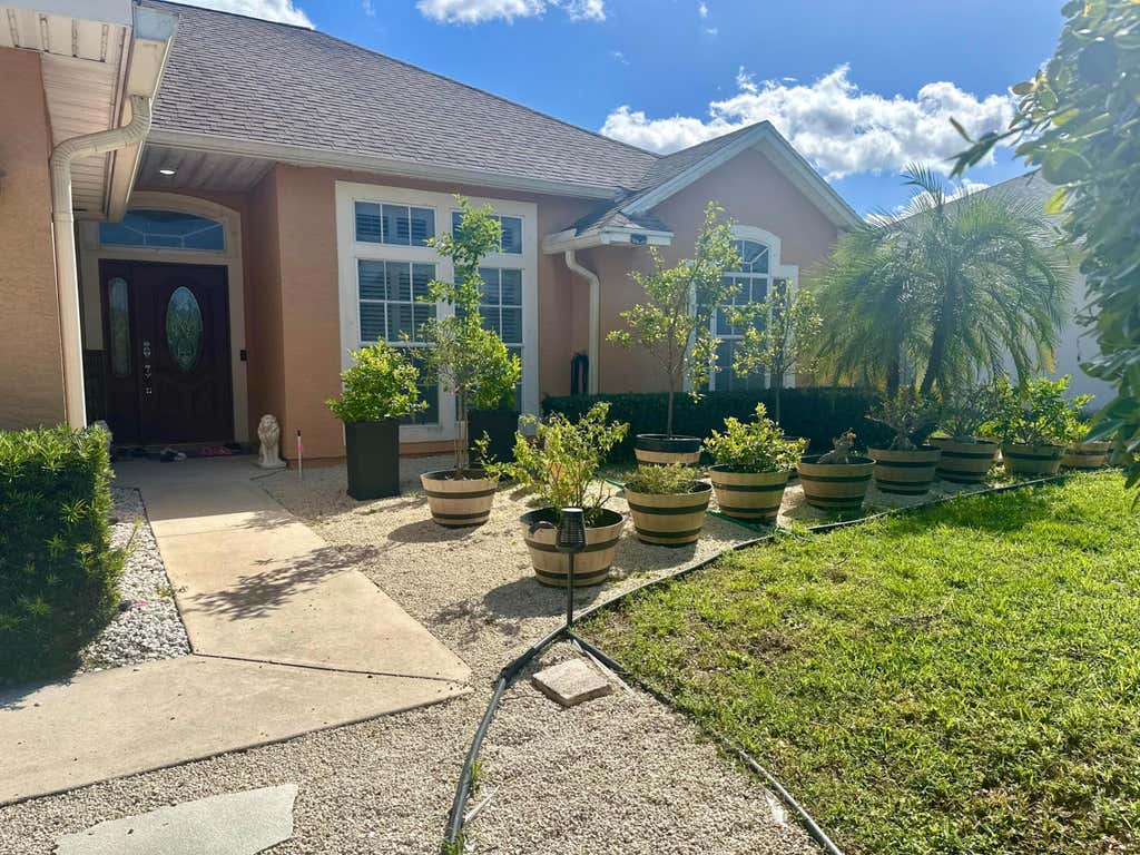 Photo of 1955 SW Castinet Lane W, Port Saint Lucie, FL 34953 (MLS # R10970630)