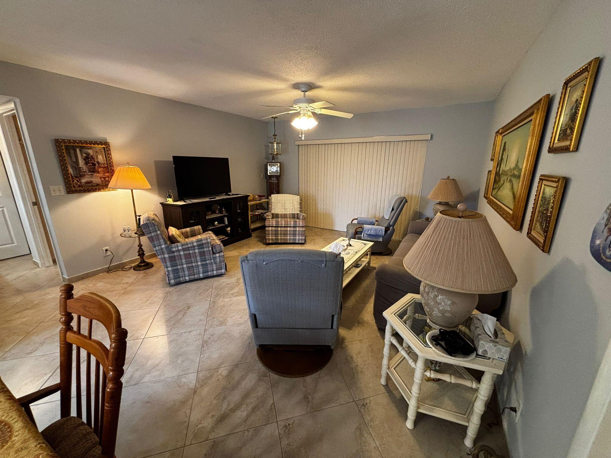 Live the ultimate Florida lifestyle in this bright, 2nd-floor condo in the heart of Lakeside Village's active 55+ community. Its prime location in Building 15 means the clubhouse, pool, and community activities are right at your doorstep, offering unmatched convenience.Relax and enjoy peaceful garden views from your large private porch. For incredible value, your water, cable, and internet are all included! The unit also comes with an assigned parking space.Join a vibrant community with access to a bustling clubhouse with two pools, a putting green, shuffleboard, and bocce courts, a full calendar of classes and social events and an on-site bus stop for easy travel.