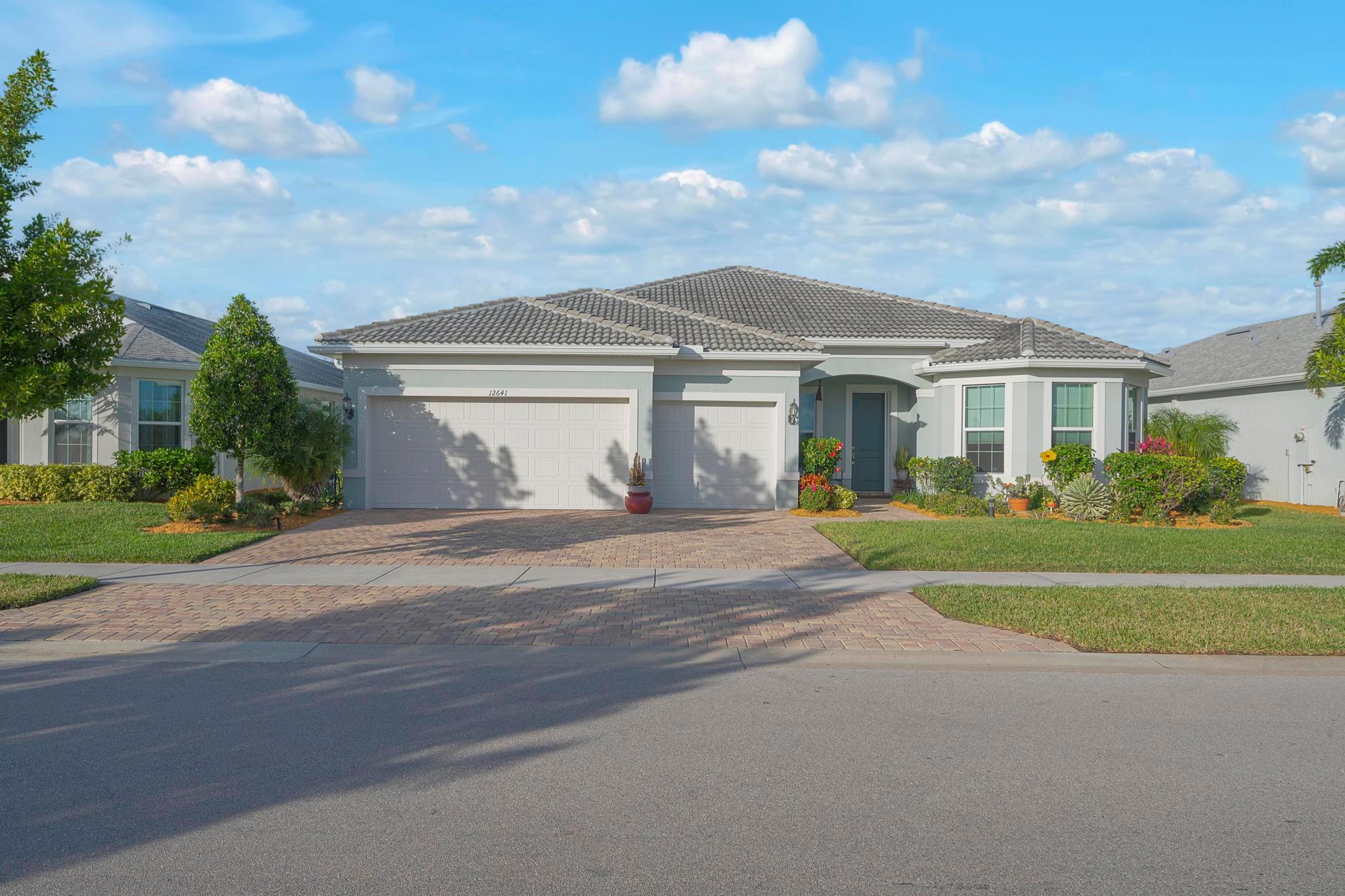 Beautiful Pinnacle model on one of the largest private lots in the neighborhood, overlooking a peaceful preserve! 3 BR 3 BA home with office/den and the fabulous open floor plan everyone desires! Tastefully appointed with many upgrades inside and out, including a charming front porch, volume ceilings, complete IMPACT glass windows, tile floors & window treatments. Chef's dream kitchen with 42-inch cabinets, stainless steel appliances, granite countertops, and an upgraded large center island. Spacious Master bedroom suite with walk-in closets and spa-like master bath. Lovely glass-enclosed four-season lanai for year-round living! Del Webb at Tradition is an active 55+ adult community. Community Features: Resort-Style Amenities with two amazing clubhouses, including two resort-style pools,