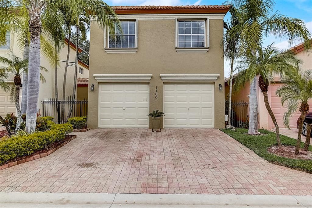 Photo of 1100 Via Jardin, Riviera Beach, FL 33418 (MLS # R10752969)