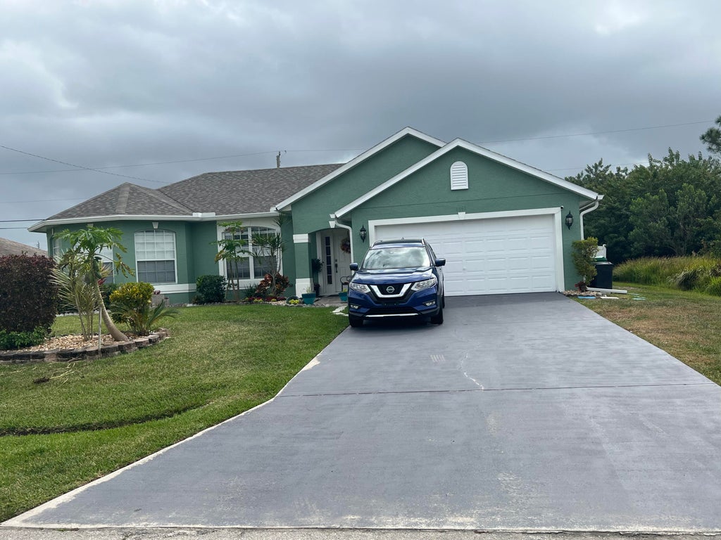 Photo of 1861 SW Lewis Street, Port Saint Lucie, FL 34987 (MLS # R10782070)
