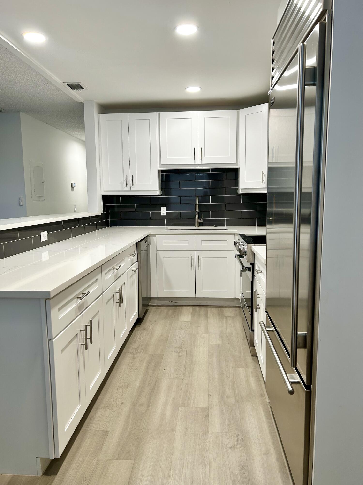 Near everything! Publix, Walgreens and CVS within walking distance along with Brass Ring Pub, Dairy Queen and Pap John's Pizza. Walk to Kelsey Park Heart Trail on the Intracoastal. Top floor 2 bedroom, 2 bath condo has a newer upgraded kitchen featuring Viking and Sub-Zero appliances with a Miele dishwasher and white soft-close cabinets. Both bedrooms have large walk-in closets. Community Laundry room is next door. Available now unfurnished for an annual lease or can be furnished for a season rental.More pictures coming soon.