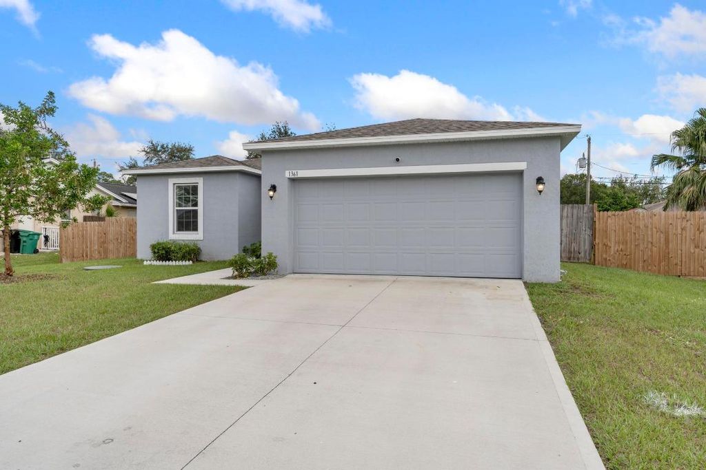 Photo of 1361 SW Granville Avenue, Port Saint Lucie, FL 34953 (MLS # R10938070)