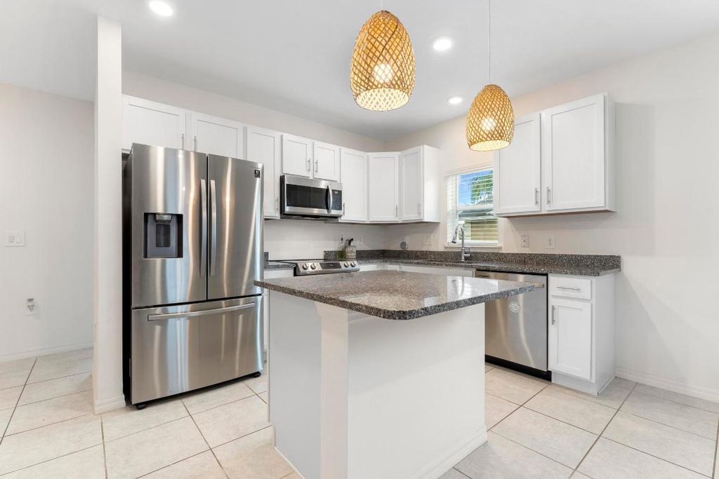 Photo of 1361 SW Granville Avenue, Port Saint Lucie, FL 34953 (MLS # R10938070)
