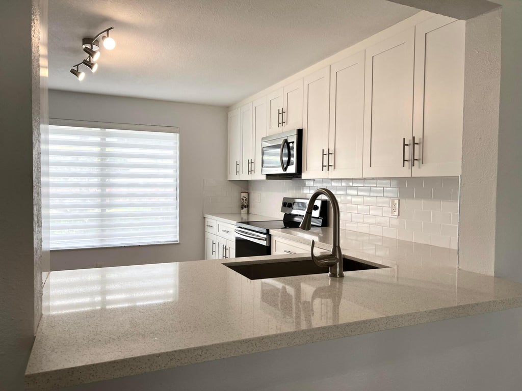 Photo of 5589 Fairway Park Drive #103, Boynton Beach, FL 33437 (MLS # R10971464)