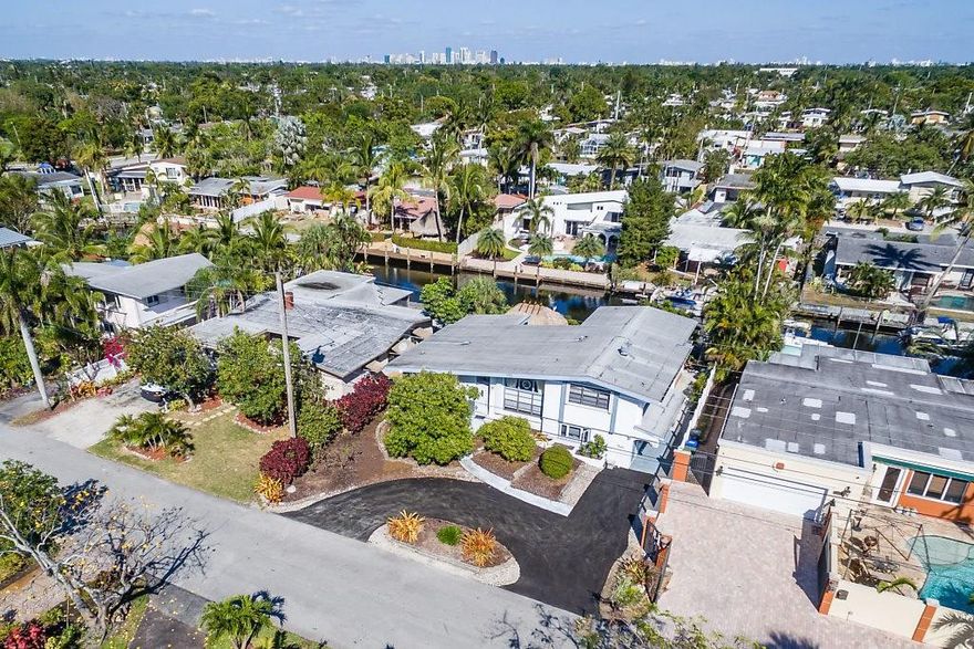 Popular Tri-Level in Lauderdale Isles with over 2400 SF. Meticulously maintained and cared for. 65 ft of Deep water Ocean Access. Vaulted wood tongue and groove ceilings, Huge entertaining living room with large porcelain tile, Chefs Kitchen with Viking gas stove, Electro-Lux Fridge, island, all wood cabinets and full wet bar. The Master Bath new in 2010 w/ Jacuzzi tub and glass enclosed shower. 2 Half Baths. Screened Florida Room. Hot tub under tropical Tiki Hut stays. Beautiful Addition in 05 w/ Permits