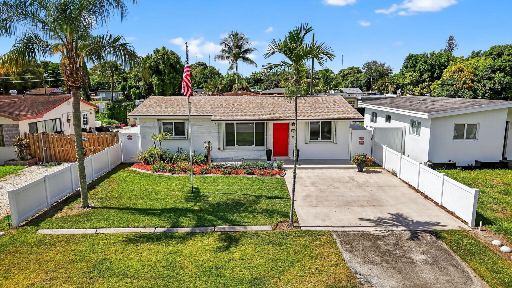 Beautifully maintained & move-in ready, this 2-bed + office/potential 3rd bedroom, 1-bath single-family home offers the best of South Florida living--just 20 minutes to the beach in Hollywood with NO HOA! Featuring complete impact windows/doors with accordion shutters, new 2023 roof, 2024 A/C, & indoor laundry. Custom oak kitchen includes stainless appliances and a double convection oven. Enjoy wood/tile floors, crown molding, LED lighting, and a lush, fenced yard with an above-ground pool with new lining, irrigation & exotic fruit trees Exterior Ring camera security system included. The detached insulated flex building in the back of the home for storage or can be converted to an office or gym - endless potential. Just 10 mins from the Hard Rock Casino. Don't miss this rare Hollywood gem!