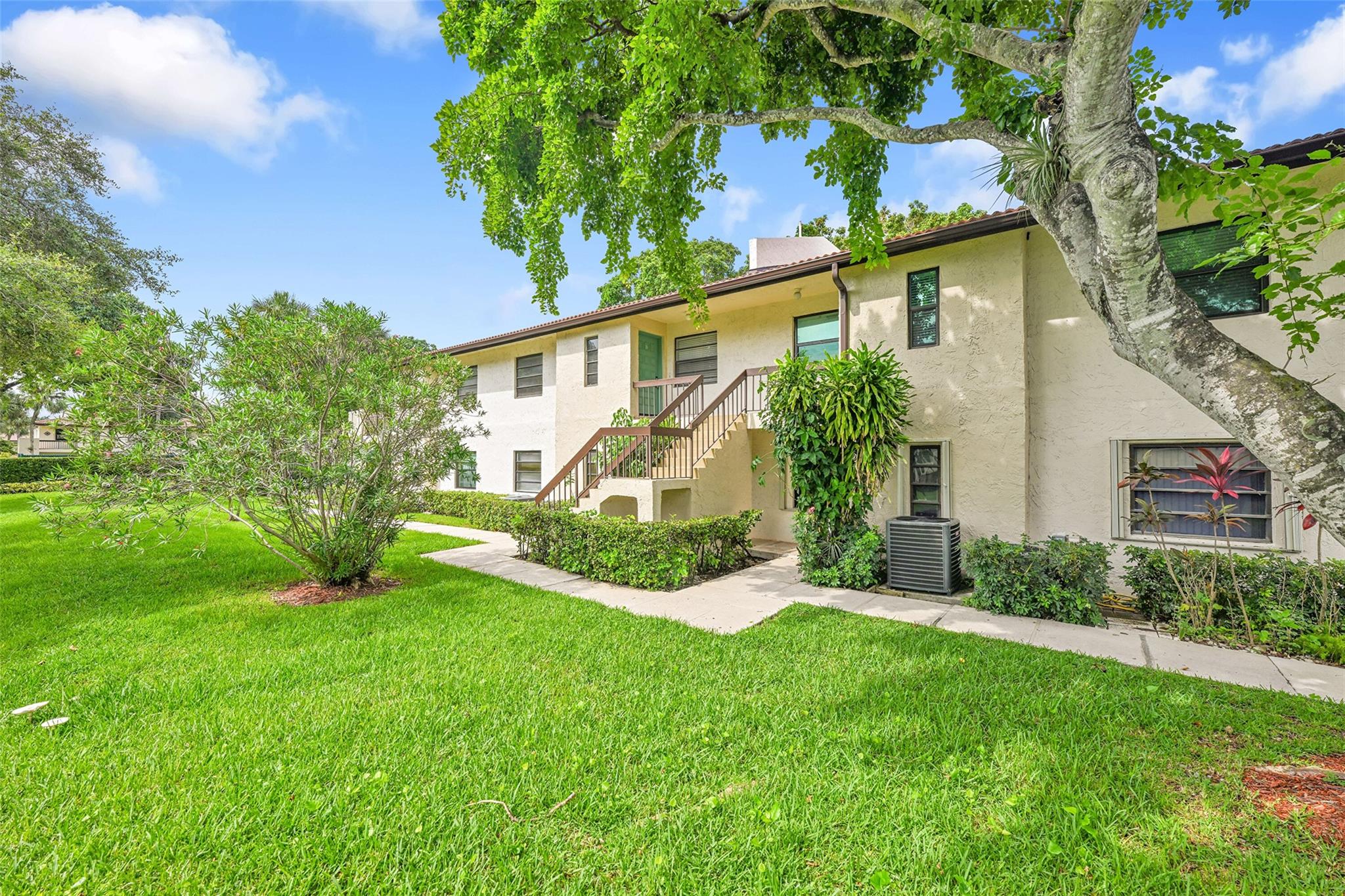 Welcome home to this charming condo in the heart of Boca Raton. This spacious residence features a gorgeous kitchen with granite countertops, rich white cabinetry, and stainless steel appliances. Beautiful tile flooring throughout the main living areas, while the master suite offers cozy carpet and an impressive three closets for abundant storage. Enjoy the convenience of an in-unit washer and dryer and the comfort of a newer A/C system. Step outside to your private balcony patio and take in the lush, tropical surroundings—perfect for morning coffee or evening relaxation. Located in a desirable community, this condo combines comfort, style, and convenience. Close to shopping, dining, and all that Boca Raton has to offer.