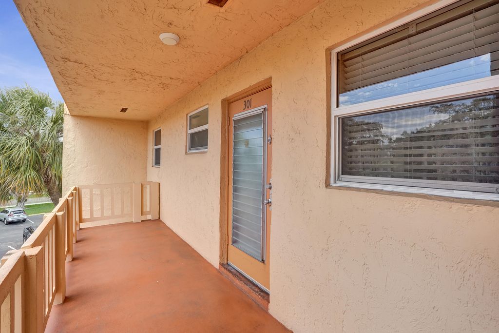 Photo of 8390 Lagos De Campo Boulevard #301, Tamarac, FL 33321 (MLS # B26019129)