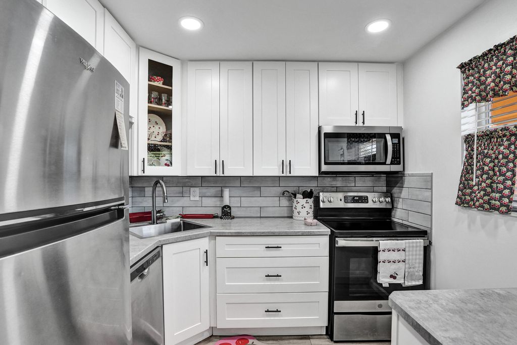 Photo of 8390 Lagos De Campo Boulevard #301, Tamarac, FL 33321 (MLS # B26019129)