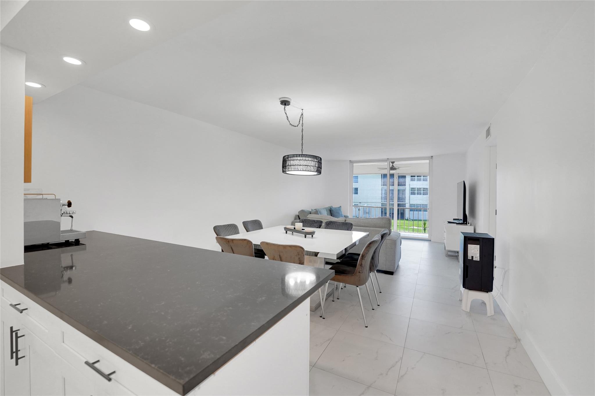 FULLY REMODELED ,ELEGANT, CORNER 2-bed, 2-bath condo in the highly desirable Hollybrook Golf & Tennis Club. AVAILABLE FOR SEASONAL RENTAL. MINIMUM 4 MONTHS RENTAL. RENTAL PRICE DROPS TO $3200 FOR 5-6 MONTH RENTAL. The ULTRA MODERN look includes all impact windows and sliding door & a reinforced steel entrance door for added safety. The fully redone kitchen includes ample counter space and STAINLESS STEEL appliances. Fully furnished this condo offers incredible amenities, including free golf on 2 18-hole courses ( cart fees apply), pickleball, tennis, heated pools, library, sauna, vehicle wash area, ELECTRIC CAR CHARGING STATIONS. Just minutes away from shopping & dining and 15 minutes from the​​‌​​​​‌​‌​​​‌‌​​​‌‌‌​​‌​​‌‌​​​​ beach.