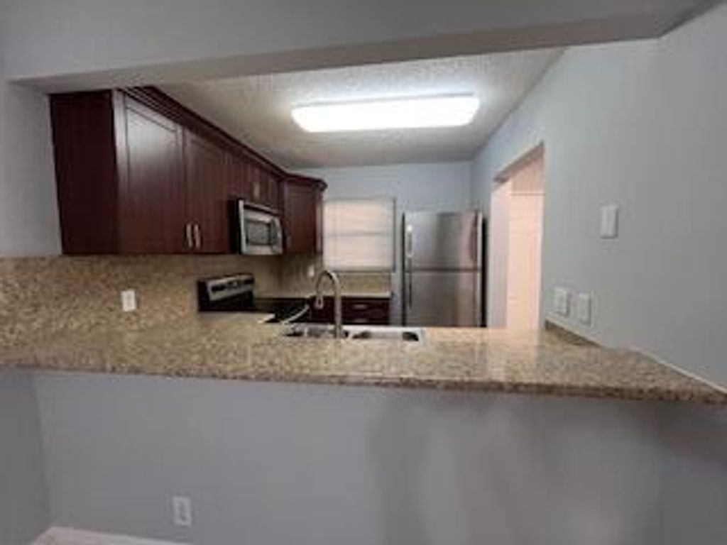 Photo of 1473 W Lake Crystal Drive #A, West Palm Beach, FL 33411 (MLS # R11159135)