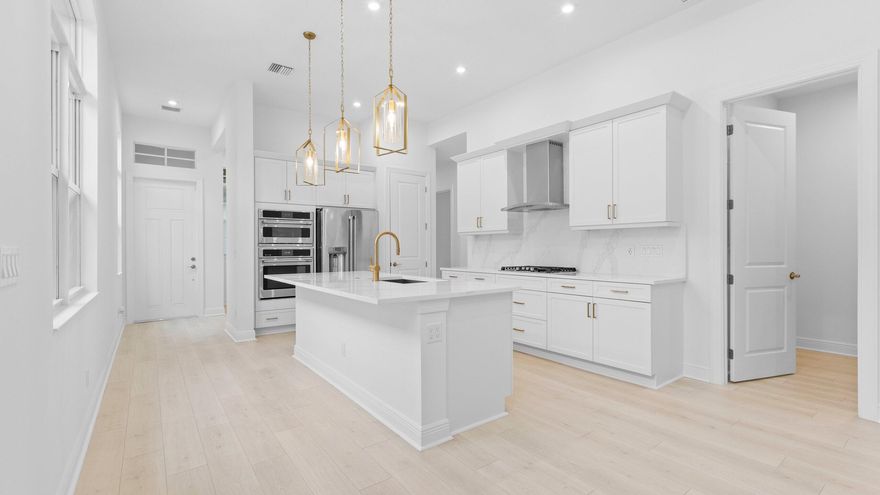 The only brand-new 4-bedroom Caroline home in Rivella on the preserve, offering exceptional privacy with no homes in front or behind and a prime location of Rivella. This beautifully designed residence features a charming coastal elevation and laminate flooring throughout for a seamless, modern feel. With 3 full bathrooms and a flexible living space ideal for a home office, media room, or playroom, the layout adapts to your lifestyle. The gourmet kitchen is the centerpiece, showcasing quartz countertops, a full quartz backsplash, and elegant gold hardware, blending style and function in a peaceful, private setting.