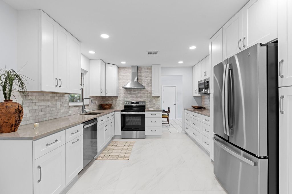 Photo of 324 Sandpiper Avenue, Royal Palm Beach, FL 33411 (MLS # B26009948)