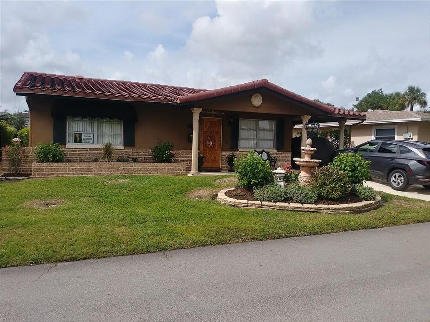 LOVELY 2 1 1/2 BEDROOM HOUSE IN TAMARAC. GRANITE COUNTER TOPS. ALL STAINLESS STEEL APPLIANCES-10 YEARS OLD- TILE ROOF-8 YEARS OLD. ELETRICAL PANEL-10 YEARS OLD. A/C IS ABOUT 5 YEARS OLD. TILE THROUGHT OUT EXCEPT FOR BEDROOMS WHICH ARE VINYL. TWO WALK IN CLOSETS. BEAUTIFUL MAHOGANY FRONT DOOR. WELL MANICURED YARD, THIS HOUSE WON THE BEAUTIFICATION RECOGNITION AWARD IN 2018. SPACIOUS SHED BY CAR PORT. 55+ COMMUNITY.
